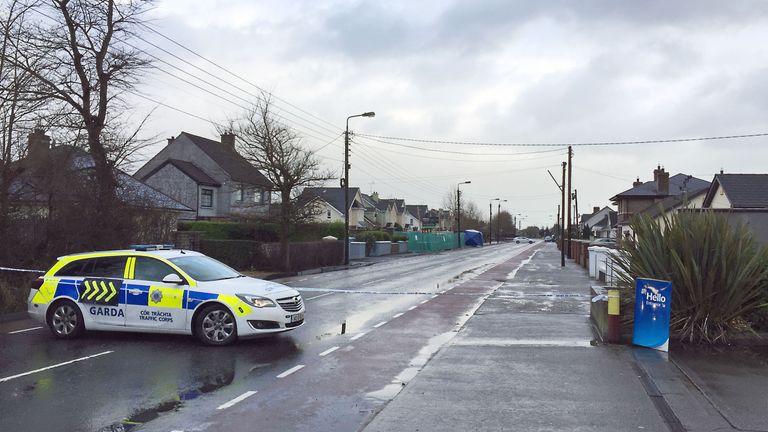 Irish police at the road in Dundalk, Ireland, where a Japanese man was stabbed
