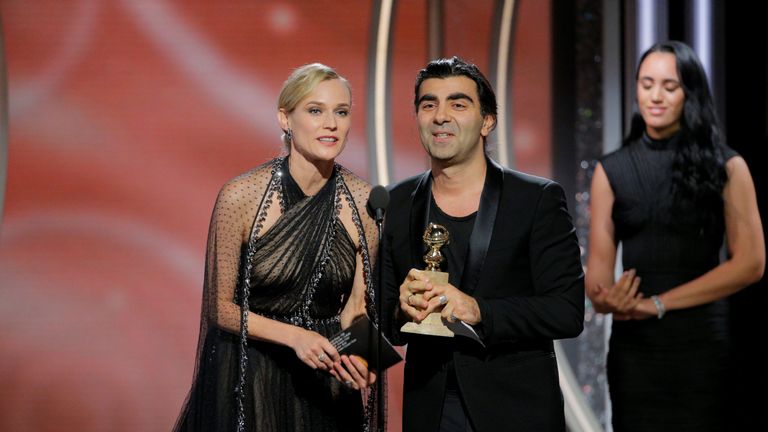 Fatih Akin, director/producer, "In the Fade" accepts the award for Best Motion Picture Foreign Language with actress Diane Kruger