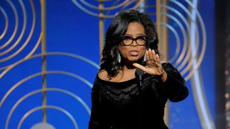 Oprah Winfrey collects her lifetime achievement award