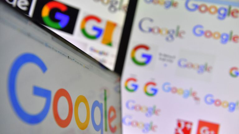 A picture taken on November 20, 2017 shows logos of US multinational technology company Google displayed on computers&#39; screens