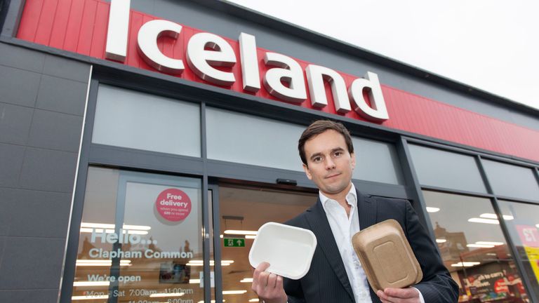 Richard Walker, with some non-plastic packaging, after they become the first major retailer to commit to eliminate plastic packaging