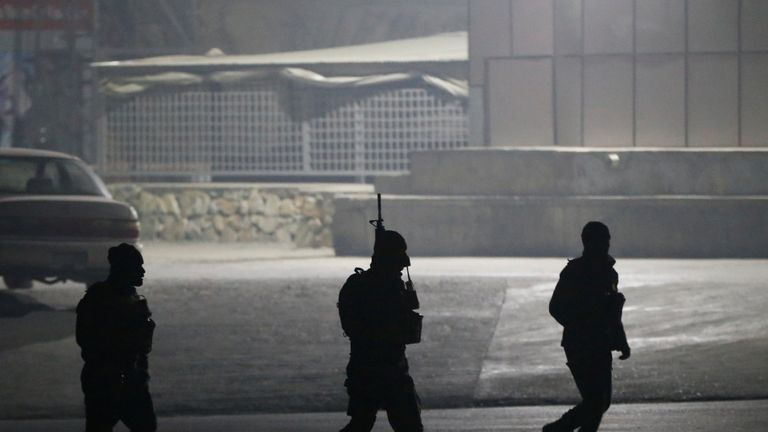 Afghan security forces arrive the site of an attack on the Intercontinental Hotel in Kabul