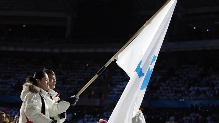North and South Korean athletes holding the Unification Flag in 2006