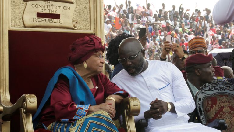 Ex-president Ellen Johnson Sirleaf speaks to her successor at his swearing-in ceremony 