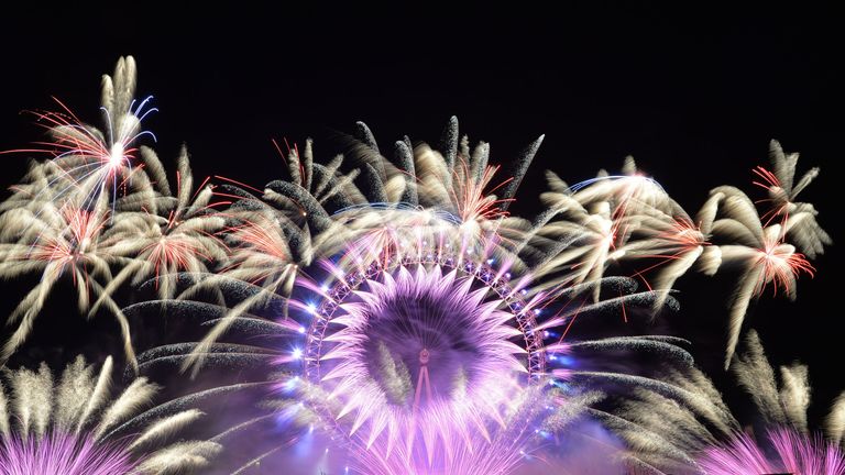 Fireworks light up the sky over the London Eye in central London during the New Year celebrations.