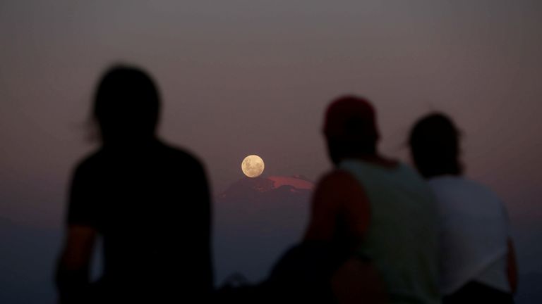 A full moon &#39;super moon&#39; rises over Los Andes mountain range in Santiago, Chile, on Tuesday