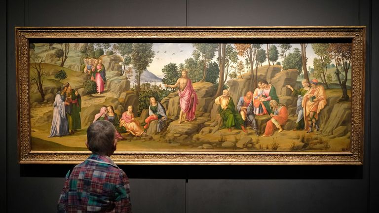 A visitor admires a Michaelangelo painting at the New York Met