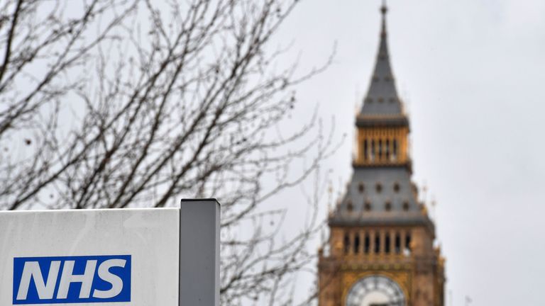 A NHS (National Health Service) sign is pictured outside St Thomas&#39; Hospital, near the Houses of Parliament, in central London on March 8, 2017. Britain&#39;s economy will grow by 2.0 percent this year, sharply up on a previous forecast of 1.4 percent, finance minister Philip Hammond said Wednesday in his budget statement. Hammond also announced a two billion pound increase in spending for social care, over the next three years, in an effort to tackle pressure on the NHS.