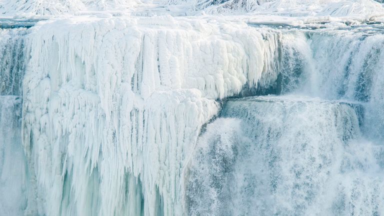 Ice hangs from the top of the American side of Niagara Falls on January 3, 2018