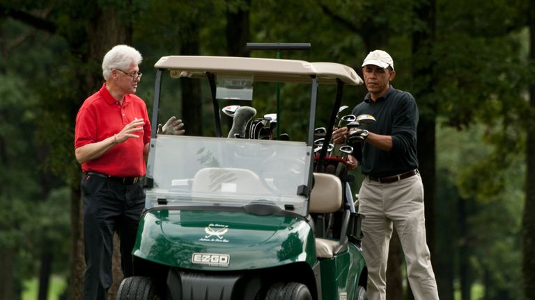 Barack Obama pictured enjoying a round with Bill Clinton in September 2011