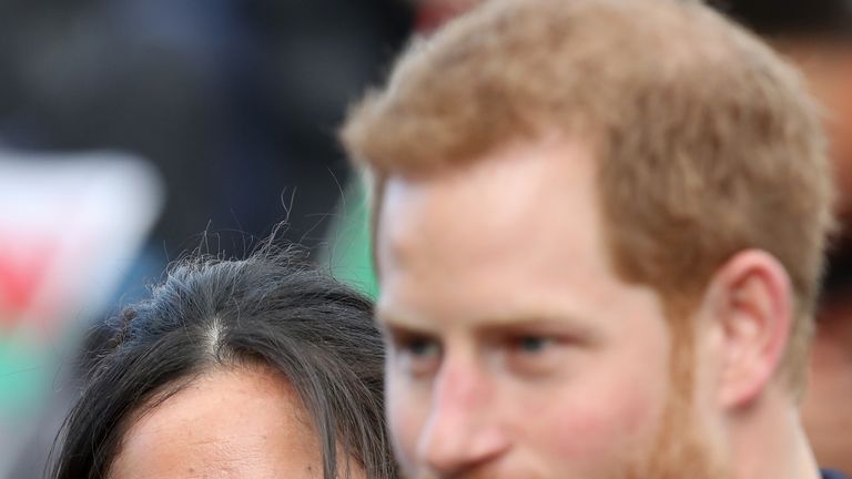 Prince Harry and his fiancee Meghan Markle are seen during a walkabout at Cardiff Castle