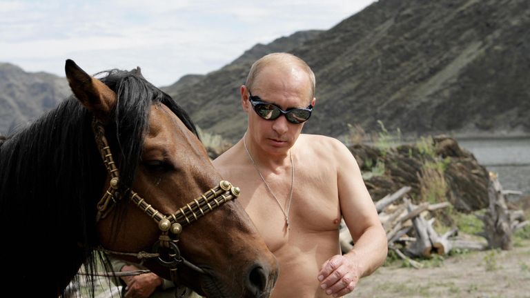 Russian Prime Minister Vladimir Putin is pictured with a horse during his vacation outside the town of Kyzyl in Southern Siberia on August 3, 2009. AFP PHOTO / RIA-NOVOSTI / ALEXEY DRUZHININ (Photo credit should read ALEXEY DRUZHININ/AFP/Getty Images)