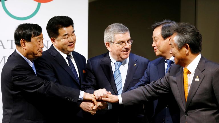 Thomas Bach, with South and North Korean officials after the announcement in Switzerland