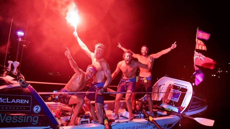 The oarsmen celebrating as they crossed the finish line after 29 days. Pic: Talisker Whisky Atlantic Challenge/Ben Duffy