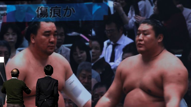 Harumafuji (L) hit junior wrestler Takanoiwa (R) in November
