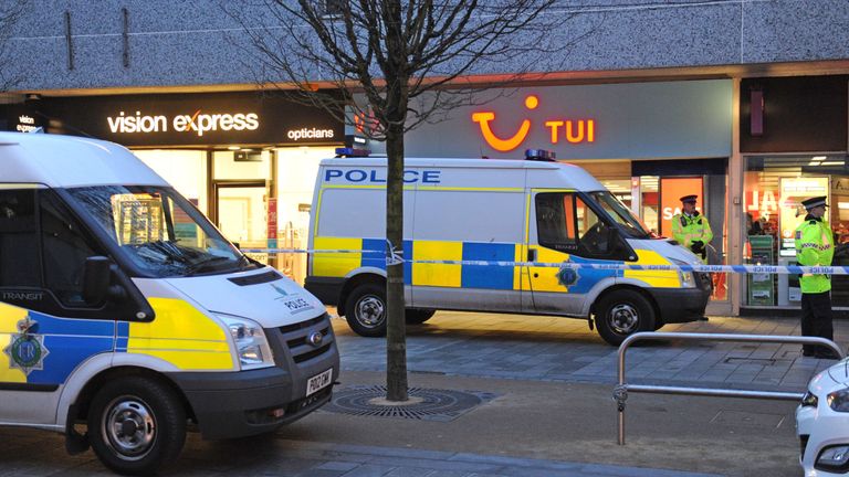 The area around the Tui travel agents remains cordoned off