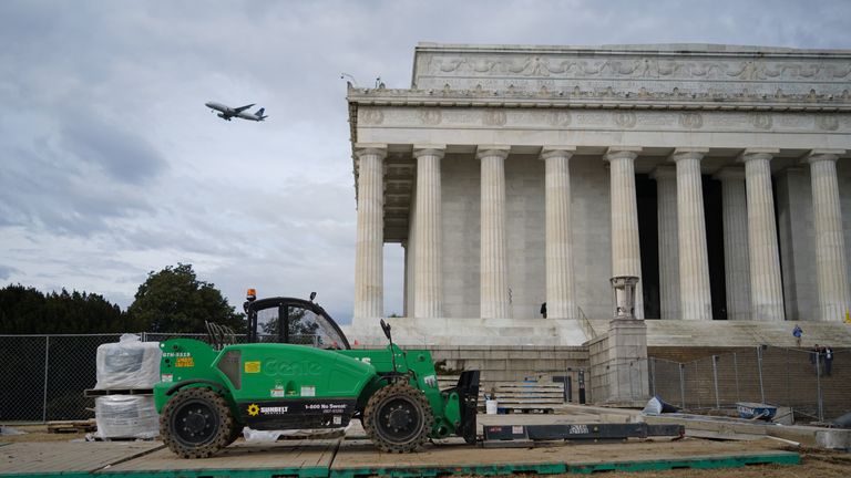 A forklift truck sits idle in front of the Lincoln Memorial during the shutdown