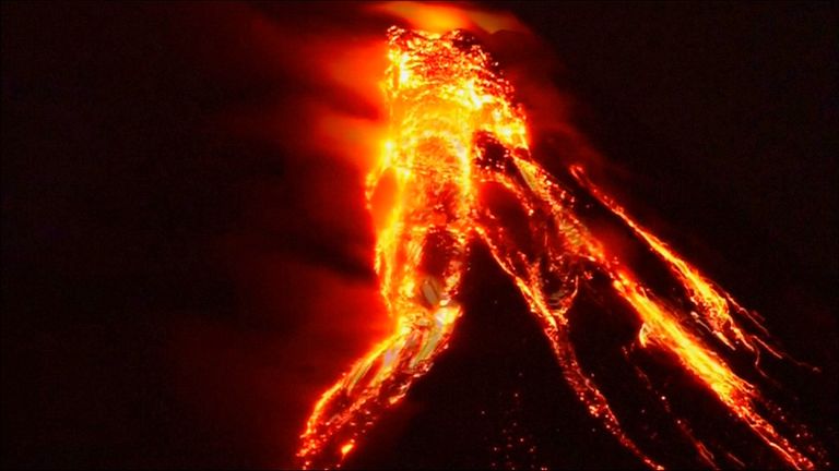Amateur video has been released showing lava trails coming from the crater of the erupting Mayon volcano in the Philippines, where more than 12,000 people have been evacuated from the local area.