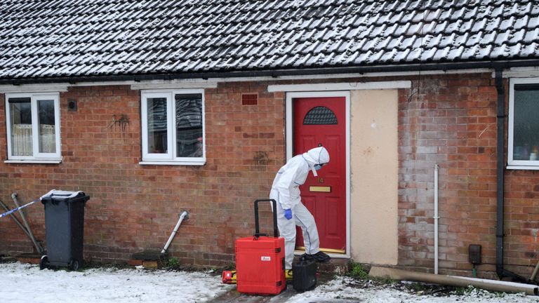 A police forensics officer at the property in Brownhills