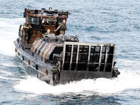 A Royal Marine landing craft births on HMS Albion during an exercise in 2010
