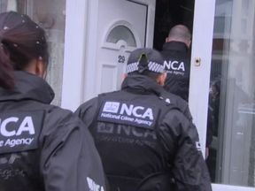 NCA officers taking part in the raids