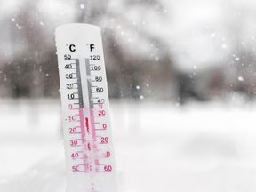 Thermometer on snow showing very low temperature