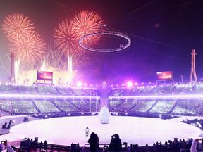 Fireworks light up the sky as the Winter Olympics opening ceremony begins