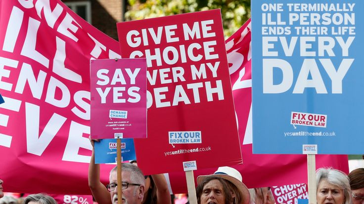 Pro assisted dying campaigners protest outside the Houses of Parliament