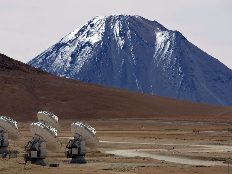 Radio telescope antennas of the ALMA (Atacama Large Millimeter/submillimeter Array) project, in the Chajnantor plateau, Atacama desert, some 1500 km north of Santiago, on March 12,2013. The ALMA, an international partnership project of Europe, North America and East Asia with the cooperation of Chile, is presently the largest astronomical project in the world. On Wednesday March 13 will be opened 59 high precision antennas, located at 5000 of altitude in the extremely arid Atacama desert. AFP PH