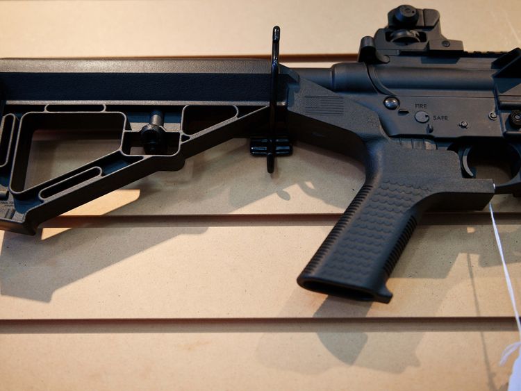 A bump stock installed on an AR-15 rifle 