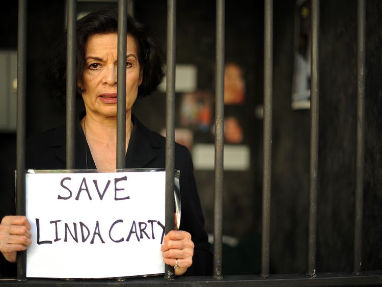 Human rights campaigner Bianca Jagger poses for photographers in a mock prison cell in London on September 7, 2010. The charity Reprieve has created a life-size death row cell to highlight the plight of British prisoner, Linda Carty who is on death row in the U.S after she was convicted for committing a murder on May 16, 2001. AFP PHOTO / BEN STANSALL (Photo credit should read BEN STANSALL/AFP/Getty Images)