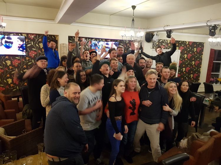 Billy's dad Eddie (R) watched the moment in a special opening of a pub Pic: Louise Godwin