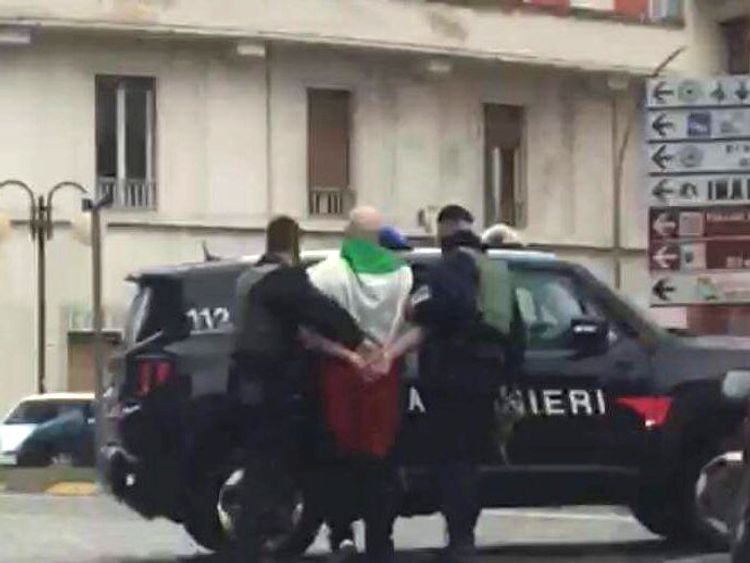 The suspected shooter that opened fire on African migrants, identified as Luca Traini, 28, is seen detained by Italian Carabinieri in Macerata, Italy February 3, 2018. Pic: Italian Carabinieri