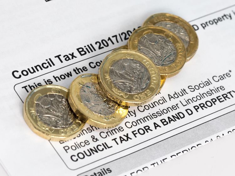New pound coins on a council tax bill