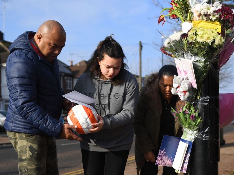 Grandfather Kim May and other family placed tributes at the scene
