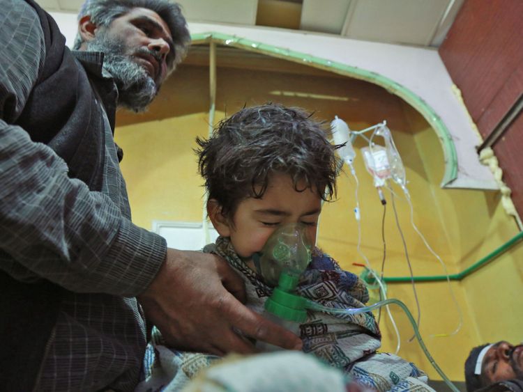 A Syrian child receives treatment for a suspected chemical attack in eastern Ghouta
