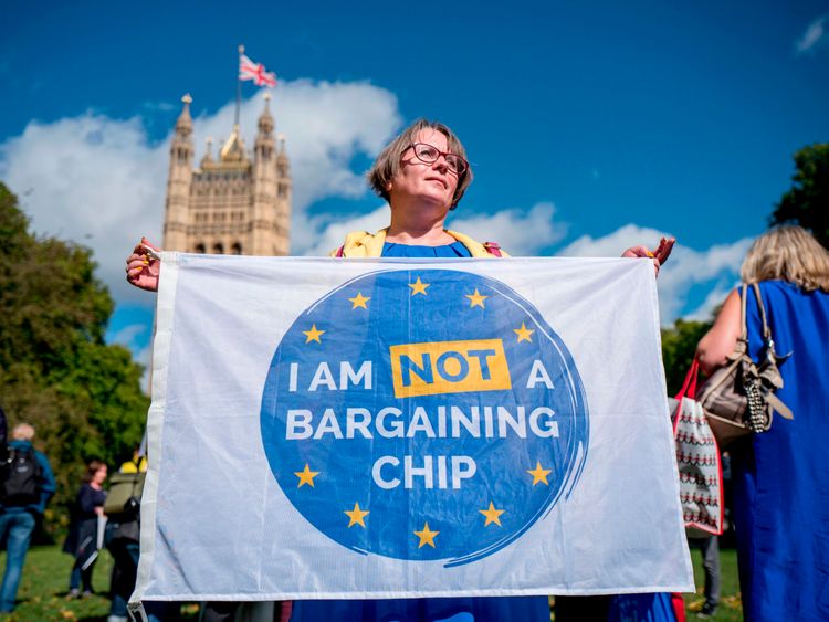 Demonstrators hold banners during a protest to Lobby MPs to guarantee the rights of EU citizens living in the UK, after Brexit, outside the Houses of Parliament in central London on September 13, 2017. After navigating the first hurdle of a key Brexit bill, British Prime Minister Theresa May on Tuesday won another parliamentary vote which will help prevent opposition MPs from blocking future legislation