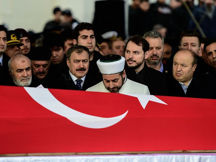 Turkey&#39;s Energy Minister Berat Albayrak (2nd R) and the father (R) and relatives of Fatih Mehmethan, a Turkish soldier killed in cross-border clashes with Kurdish People&#39;s Protection Units (YPG) forces in Afrin