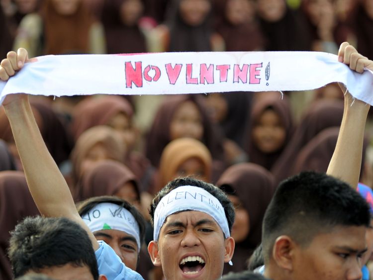 Indonesian Muslim students campaign against the celebration of Valentine&#39;s Day in Banda Aceh on February 13, 2016. Muslim clerics across Indonesia have warned against celebrating Valentine&#39;s Day, which they regard as Western celebration that promotes sex, drinking alcohol and drug use. AFP PHOTO / Chaideer MAHYUDDIN / AFP / CHAIDEER MAHYUDDIN (Photo credit should read CHAIDEER MAHYUDDIN/AFP/Getty Images)

