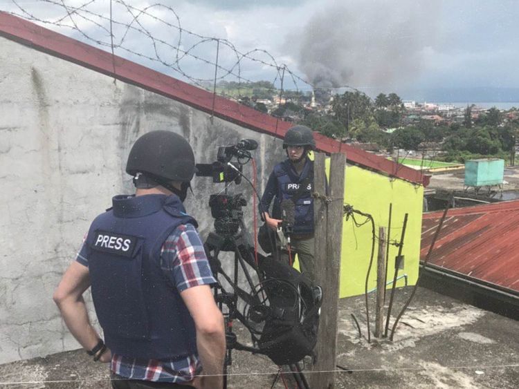 Katie and her team wearing helmets and bullet proof vests in Marawi