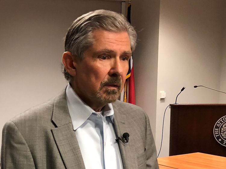 Kent Whitaker speaks to reporters after asking the chairman of the Texas Board of Pardons and Paroles