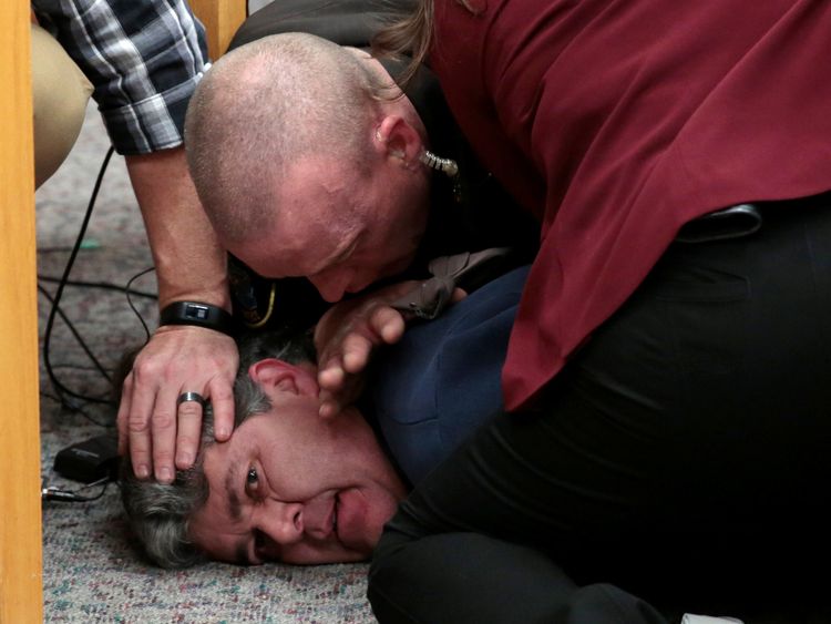 Eaton County Sheriffs restrain Randall Margraves after he lunged at Larry Nassar