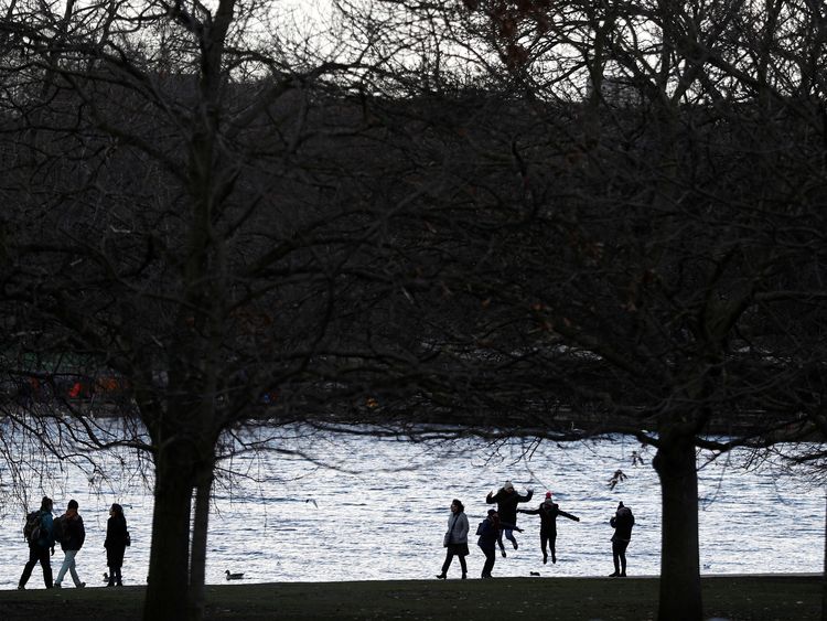 People play in Hyde Park, London, on a snowy Sunday 11 February
