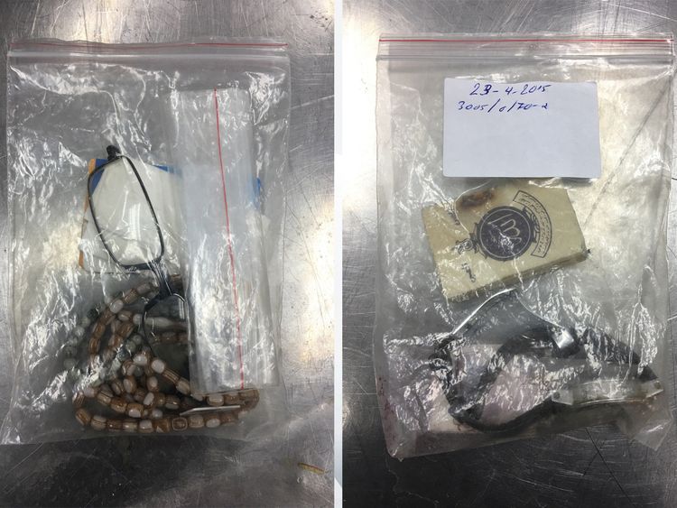 Glasses and prayer beads; a watch and prayer book