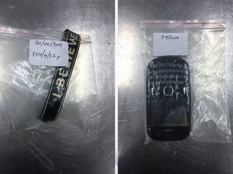 A 'believe' wristband; a phone