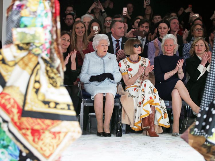 The Queen appeared surprised at some of the outfits as she sat next to Anna Wintour