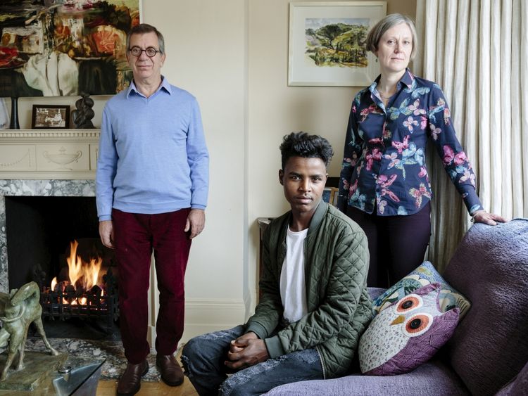 Charles and Katharine Elliott host young Ethiopian Hussein. Pic. UNHCR/Aubrey Wade