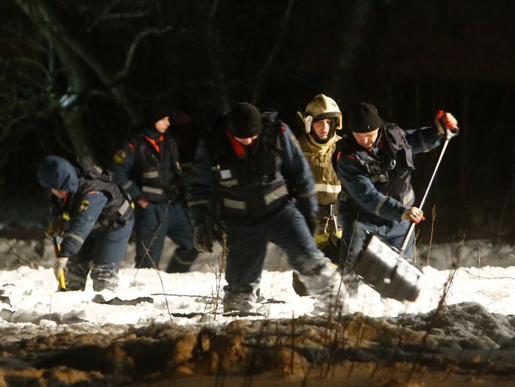 Rescue workers combing the crash site