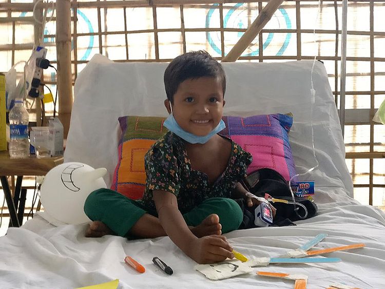 Six-year-old Sumaiya, sitting up in bed and already recovering after receiving diphtheria antitoxin treatment