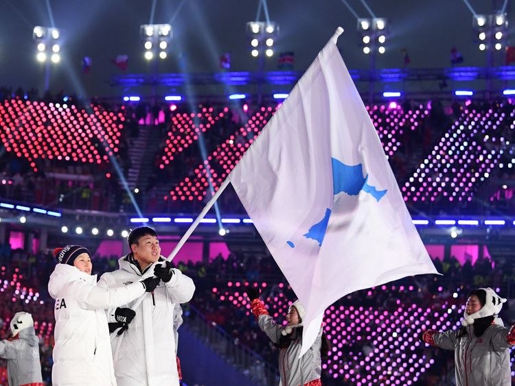 Flag bearers Chung Guam Hwang and Yunjong Won of Republic of Korea leads the team during the Opening Ceremony of the PyeongChang 2018 Winter Olympic Games